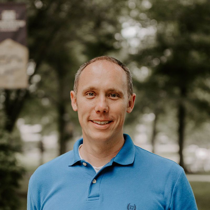 Houghton professor J.L. Miller with blue polo shirt.