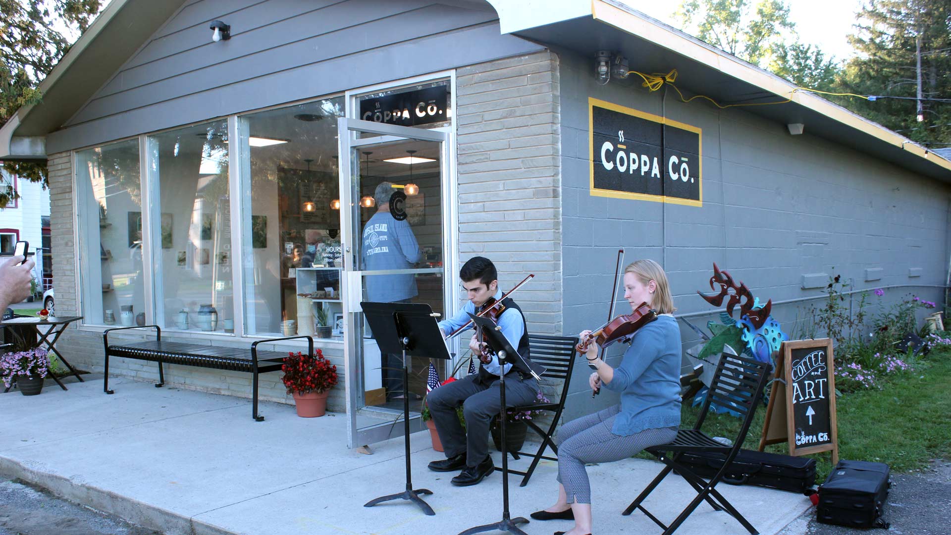 musicians performing in front of Coppa Co