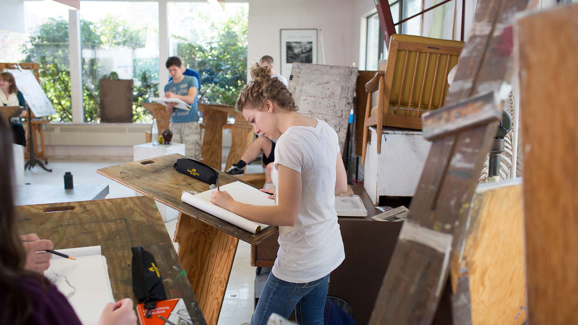 Students standing at work in the drawing studio