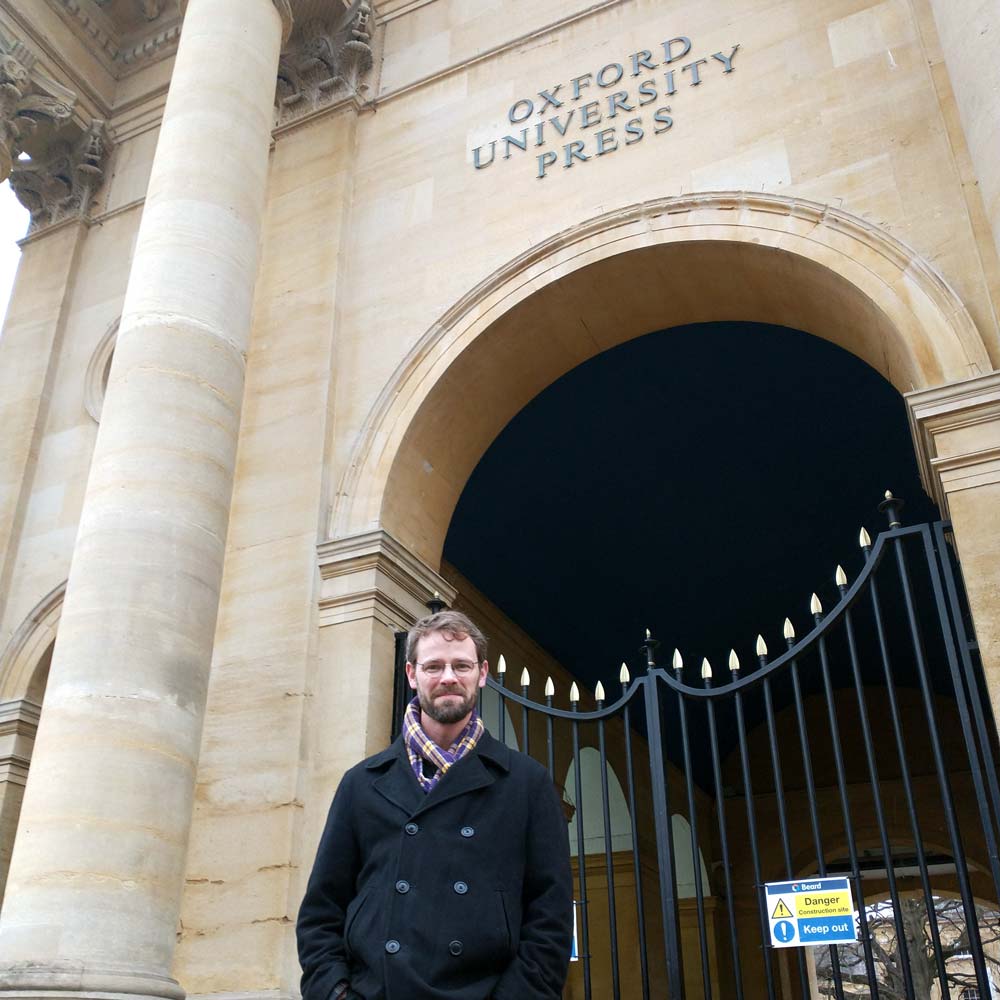 Benjamin Lipscomb in front of Oxford University Press