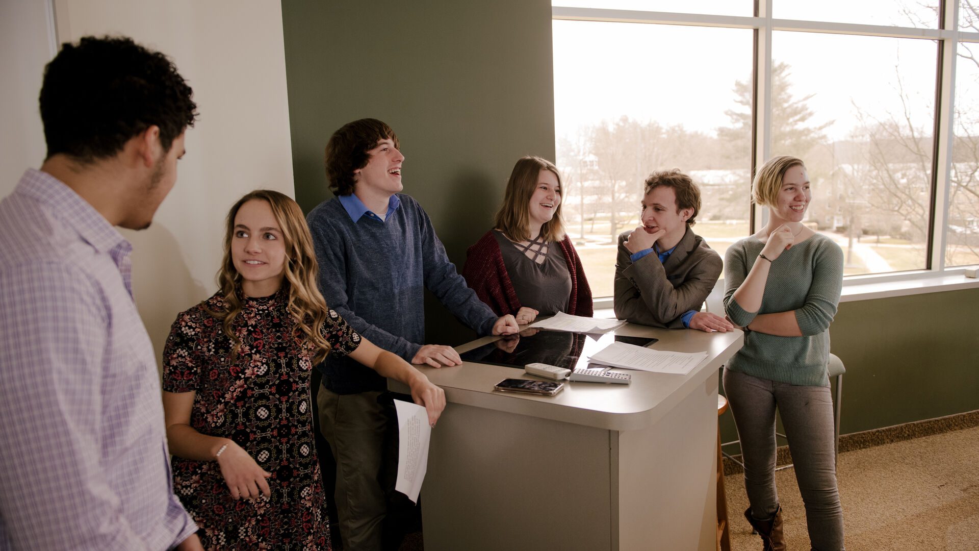 business students conversing before a presentation