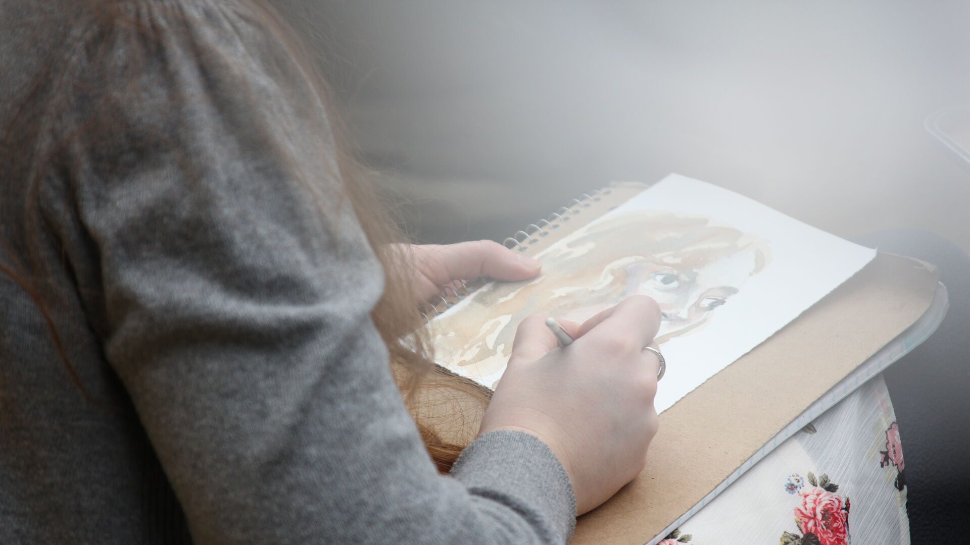 Student using watercolor paints.