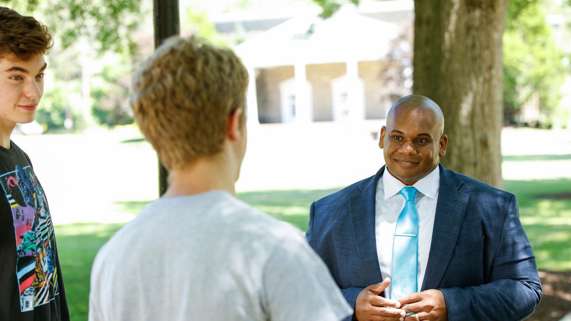 President Lewis speaking to students on Houghton's campus.