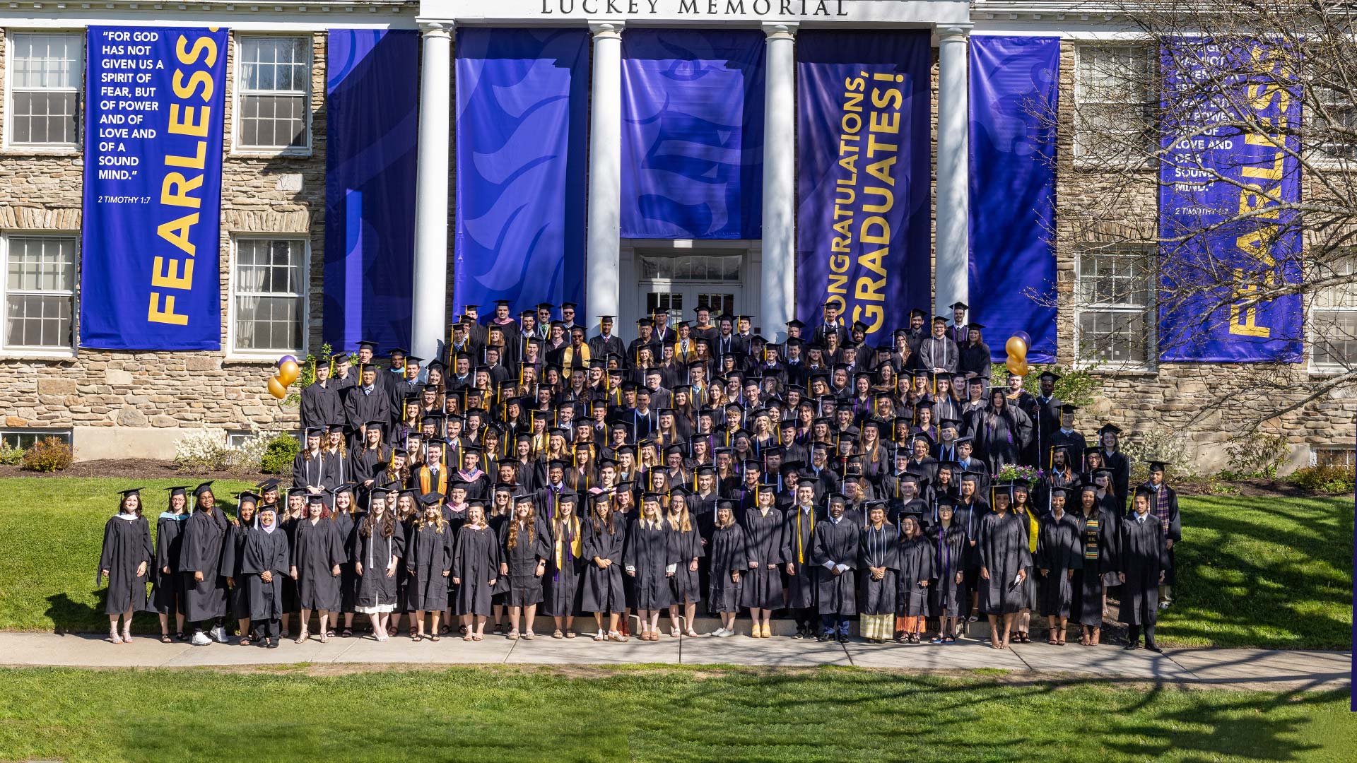 Houghton's class of 2022 stand on the steps of Luckey Building for a class photo