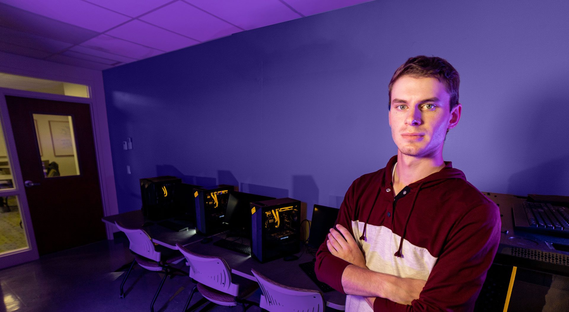 Isaac Cassulis standing in computer lab