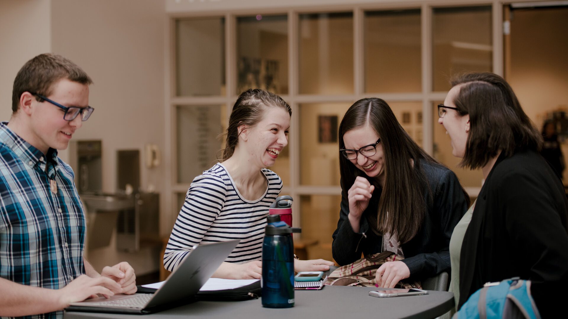 Students sitting together and laughing