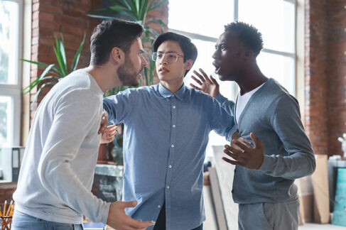 Three men in a heated argument