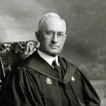 Black and white photograph of President Luckey with regalia.