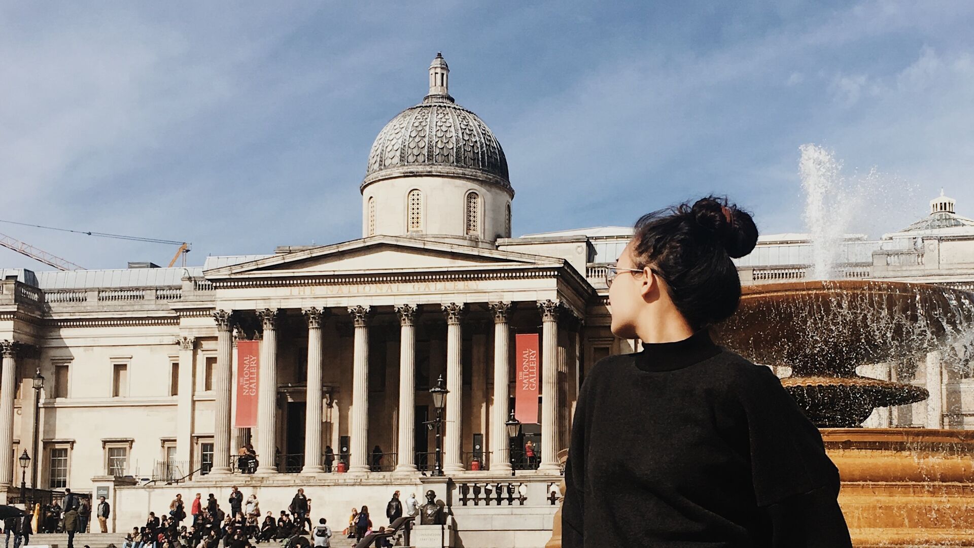 Student looking at historic building Trafalgar as part of London Honors