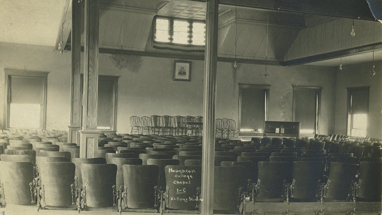 Historic black and white photograph of the empty old chapel at Houghton University.