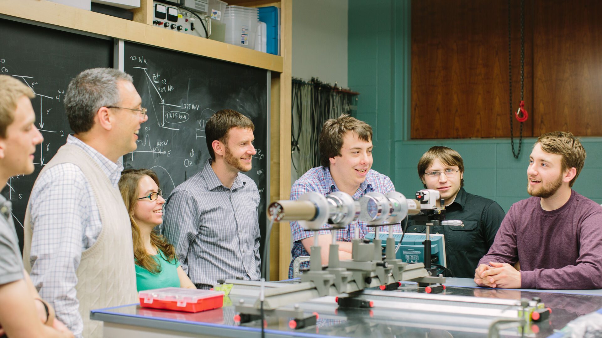 Houghton students in physics classroom with professor.
