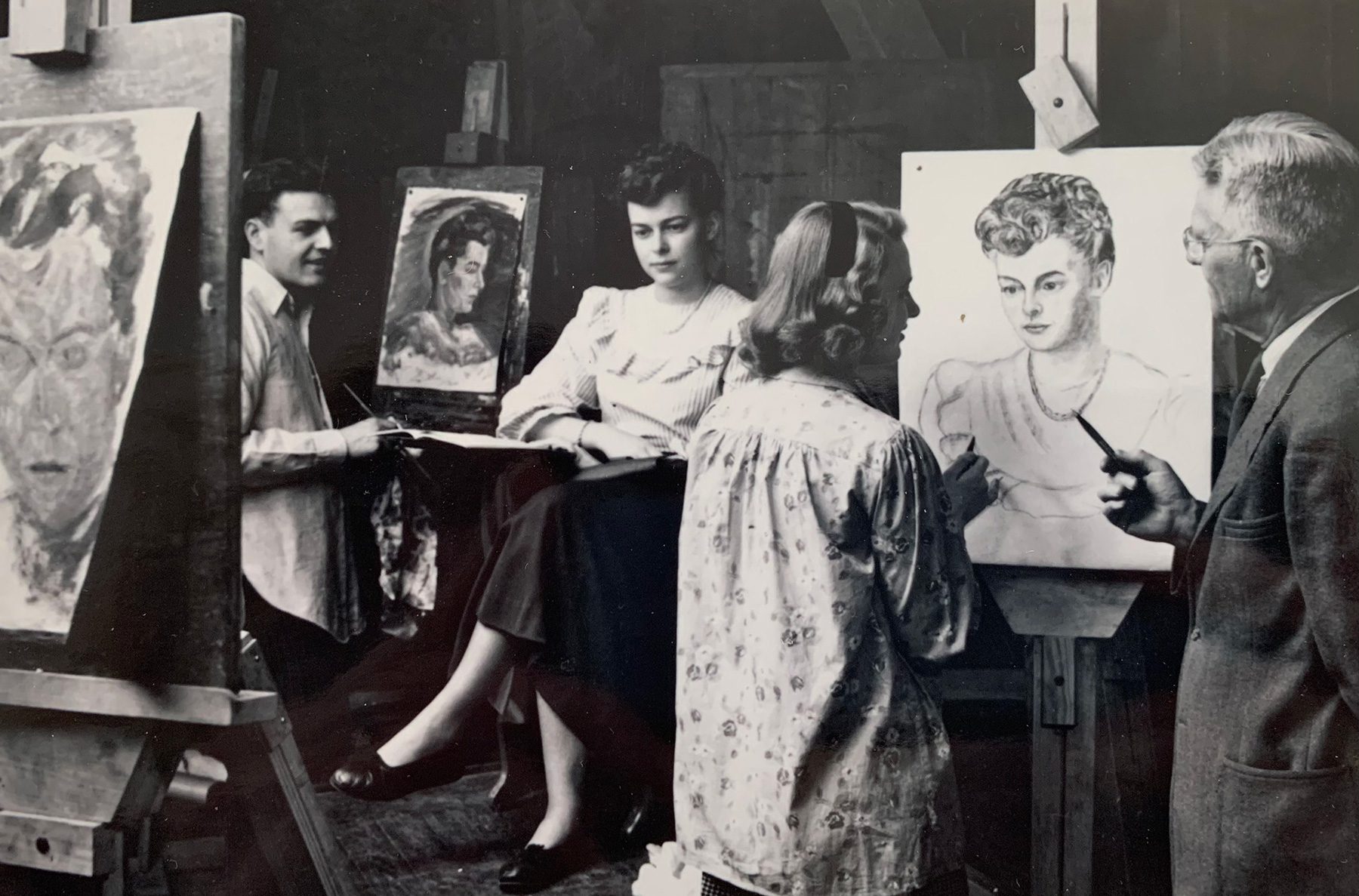 Black and white archival photograph of H. Willard Ortlip teaching painting.