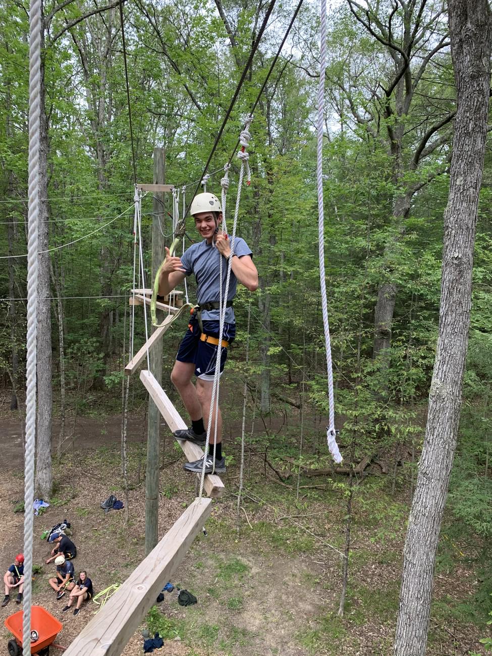 Houghton students standing on ropes course during Highlander Wilderness Adventure.