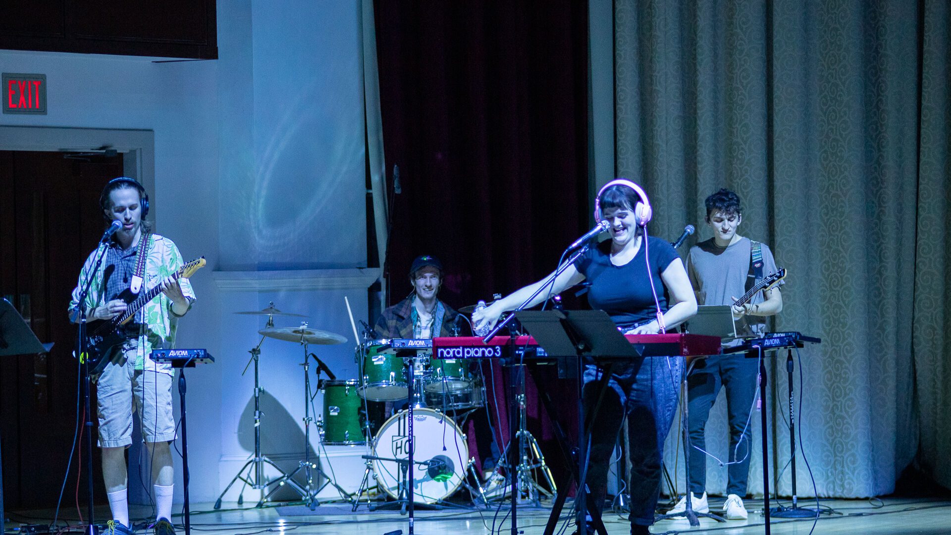 Houghton students performing music on stage during SPOT.