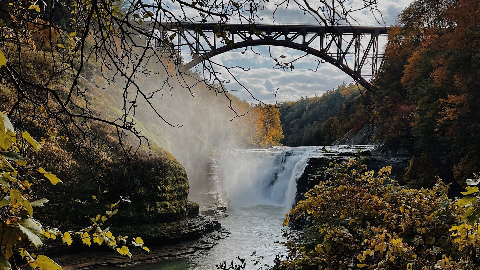 Waterfall and bridge in the fall in Letchworth NY State Park.