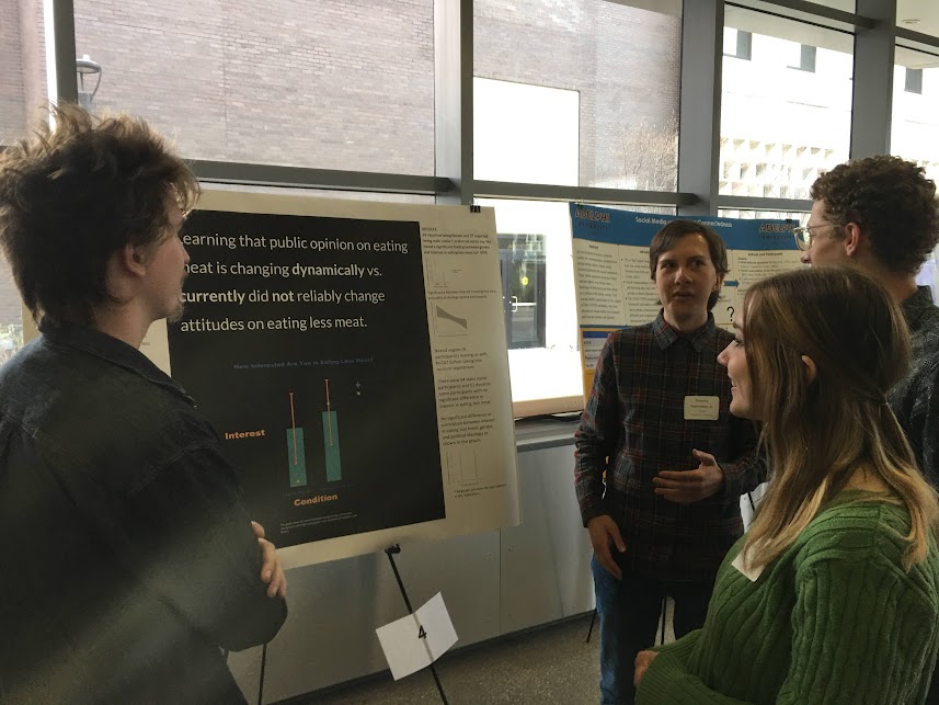 Houghton students presenting their poster
