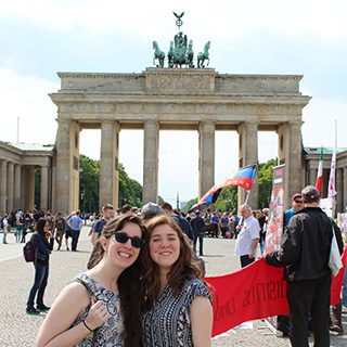 Two Houghton students standing in front of famous monument in Germany.