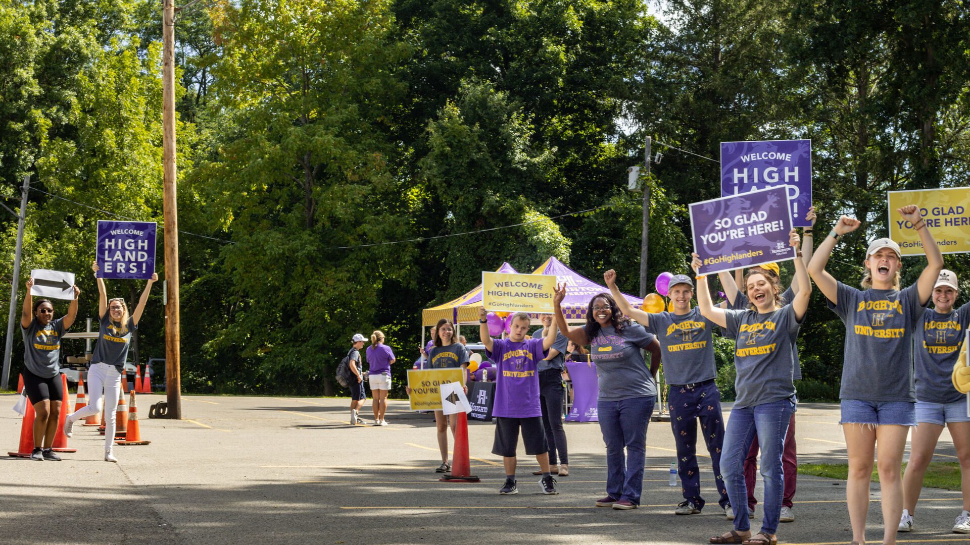 Houghton staff students welcoming incoming families during move-in day.