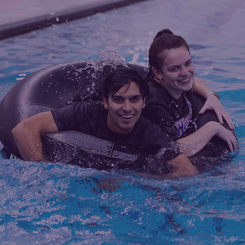 Two Houghton students playing water polo.