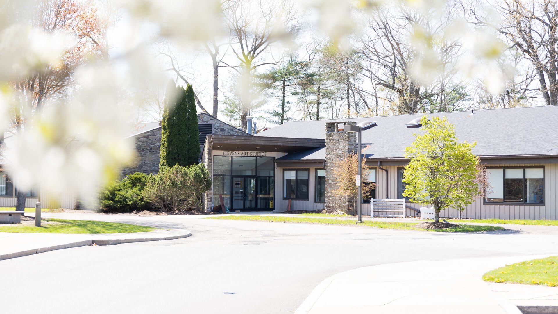 Exterior shot of the Stevens Art Studios in the spring at Houghton University.