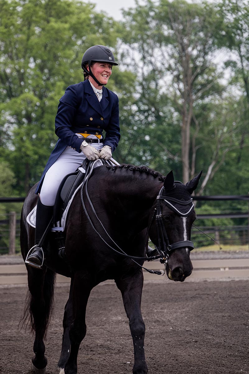 Houghton professor Larissa Ries riding horse at Equestrian Center.