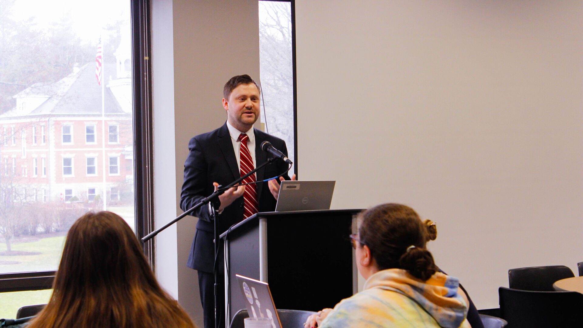 Man standing at podium during Houghton Best Talk.