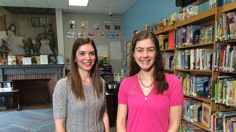 Two Houghton students standing in Buffalo library as par to service project.