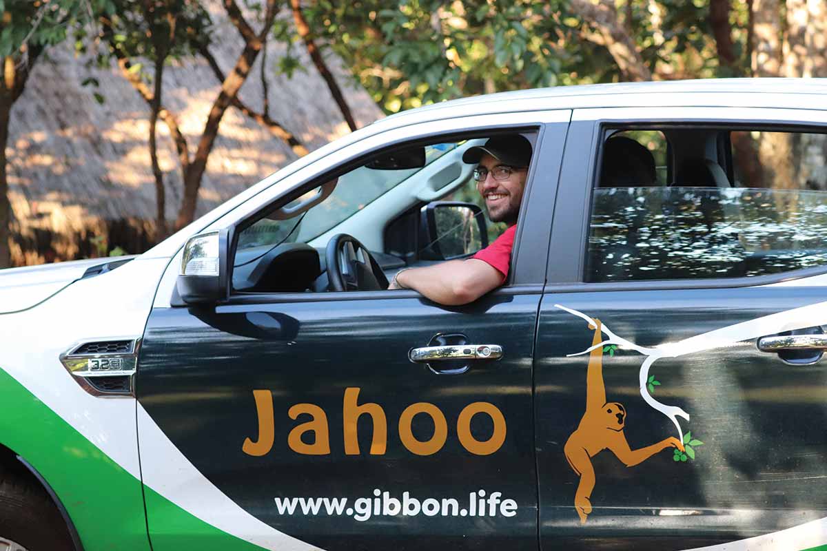 Kyle Burrichter sitting in Jahoo vehicle in Cambodia.