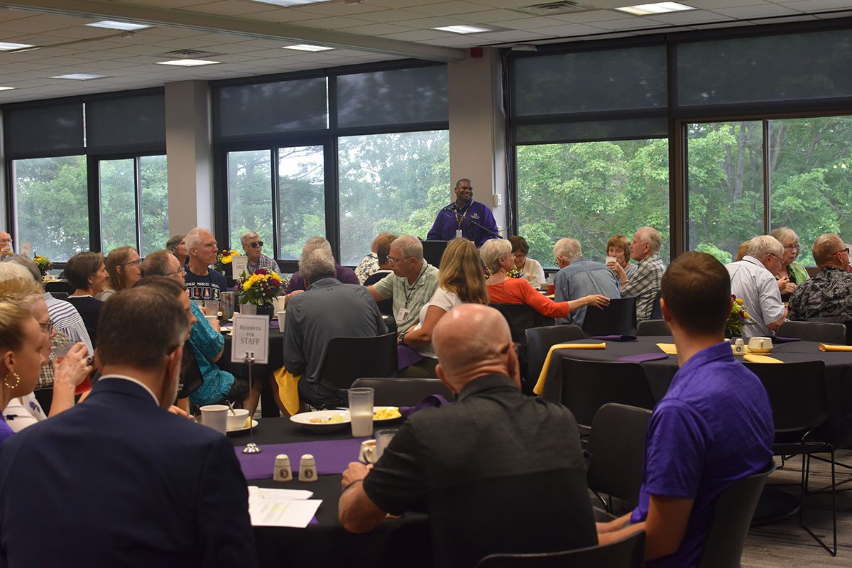President Lewis speaking to alumni at the summer class reunions.