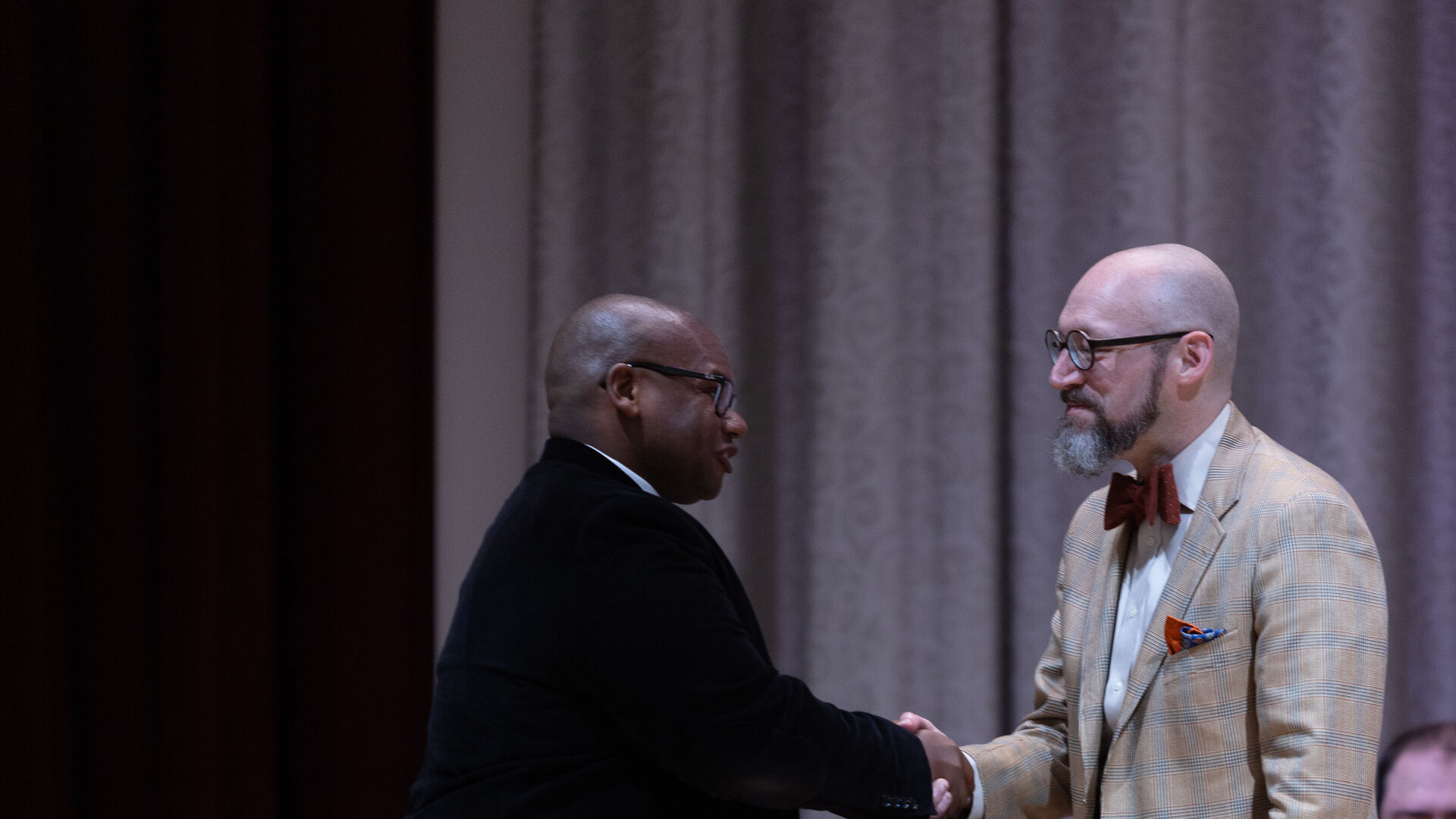 Houghton alumnus Jeffrey Thompson accepts alumni award from President Lewis.