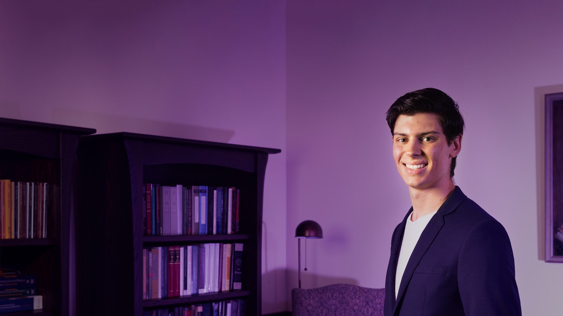 Cody Johnson smiling at camera in Lindley Center for Constitutional Studies at Houghton University