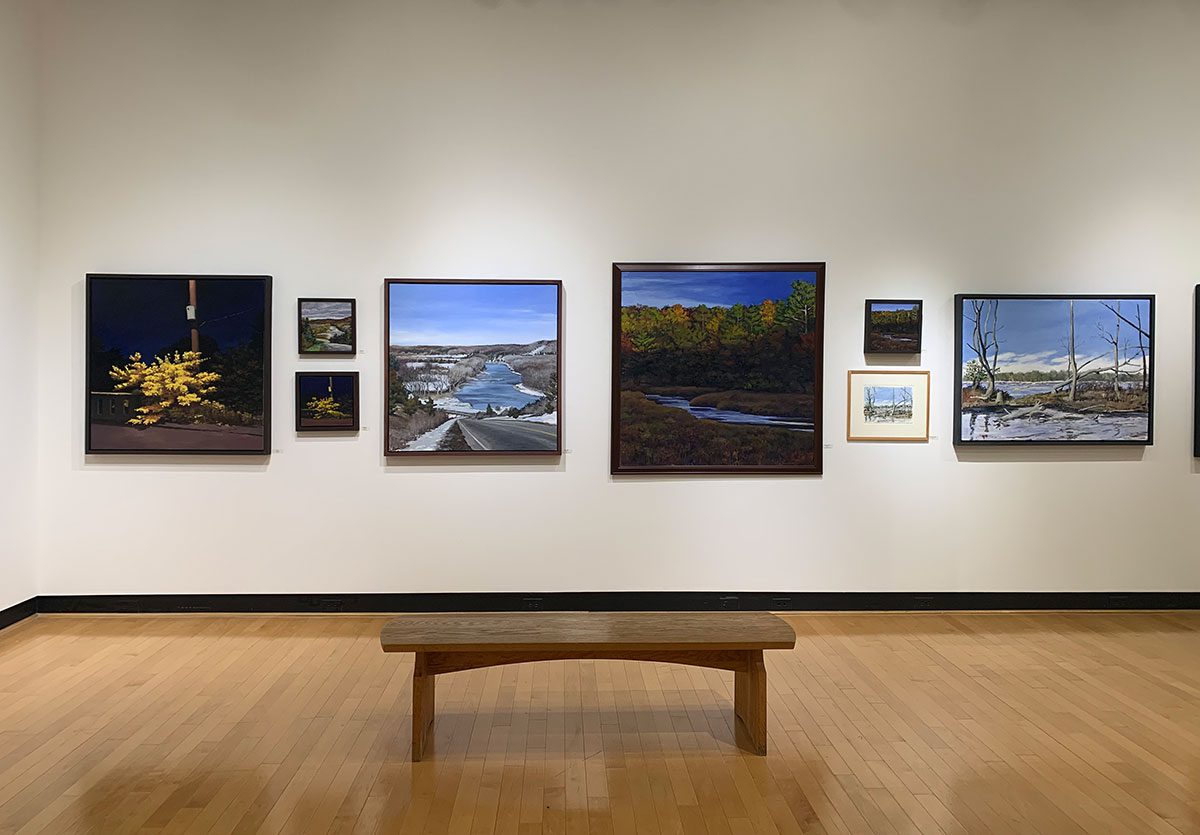View of several of John Rhett's paintings in the Ortlip Gallery Houghton.