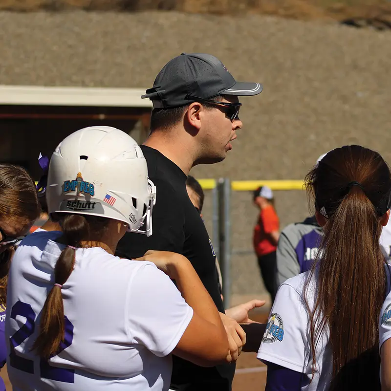 Houghton athletic coach Chad Muise coaching the softball team.