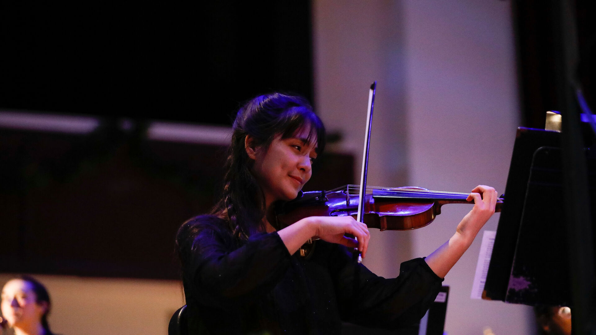 Houghton student playing violin during Prism Concert.