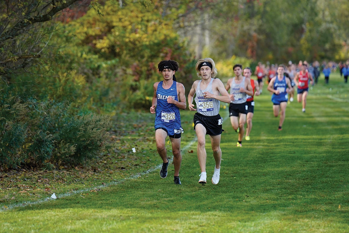 Houghton men's cross country team competing during track meet.