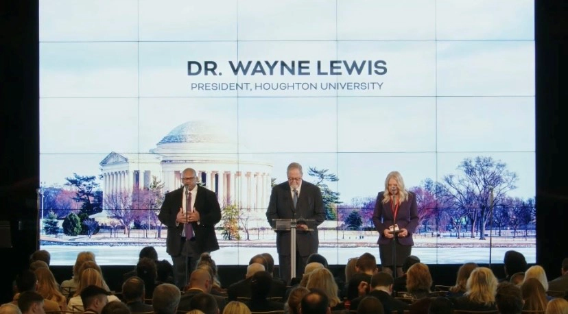 Houghton President, Wayne Lewis on stage with two others during National Gathering for Prayer and Repentance in Washington D.C.