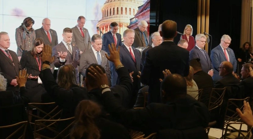 A group of people on stage during the National Gathering for Prayer and Repentance in Washington D.C.