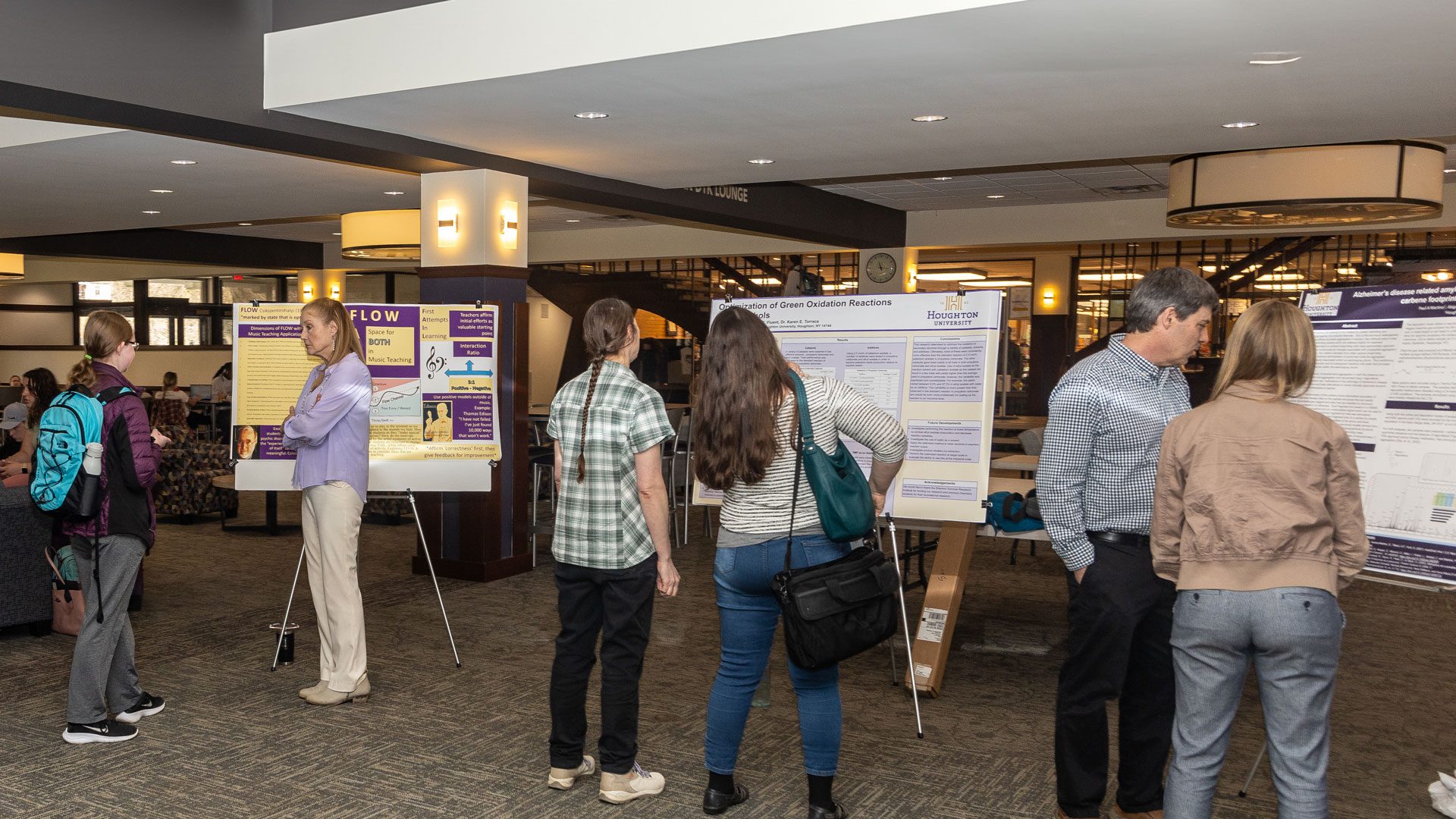 faculty present poster sessions of their research on faculty scholarship day