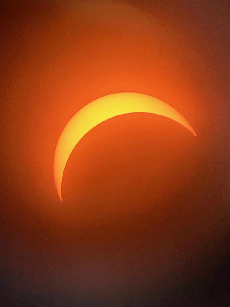 Partial eclipse of the moon over the sun.