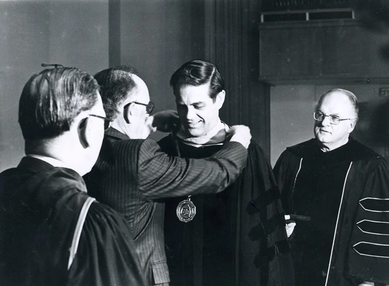Houghton president emeritus Dan Chamberlain receiving medallion at inauguration.