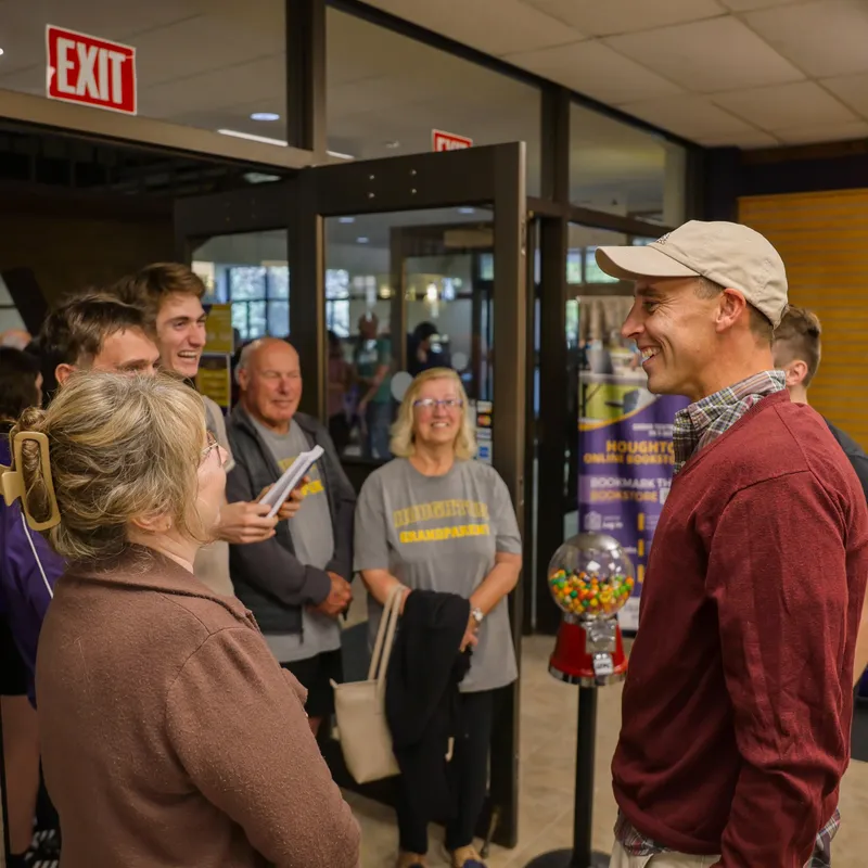 alumni talking in the bookstore