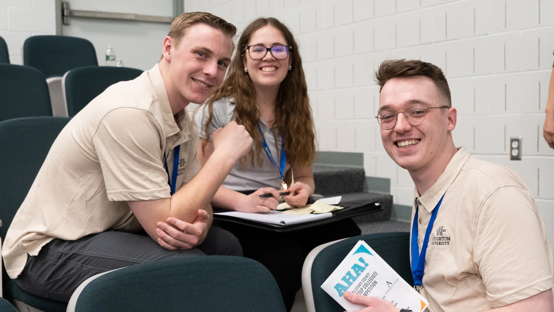 Three Houghton business students at conference.