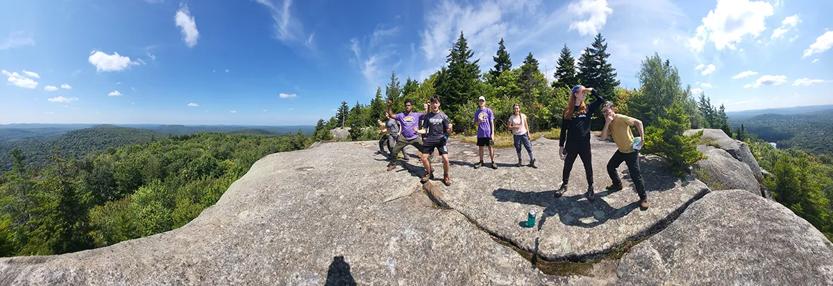 Wide angle shot of the Houghton Highlander Wilderness Adventures on mountaintop.