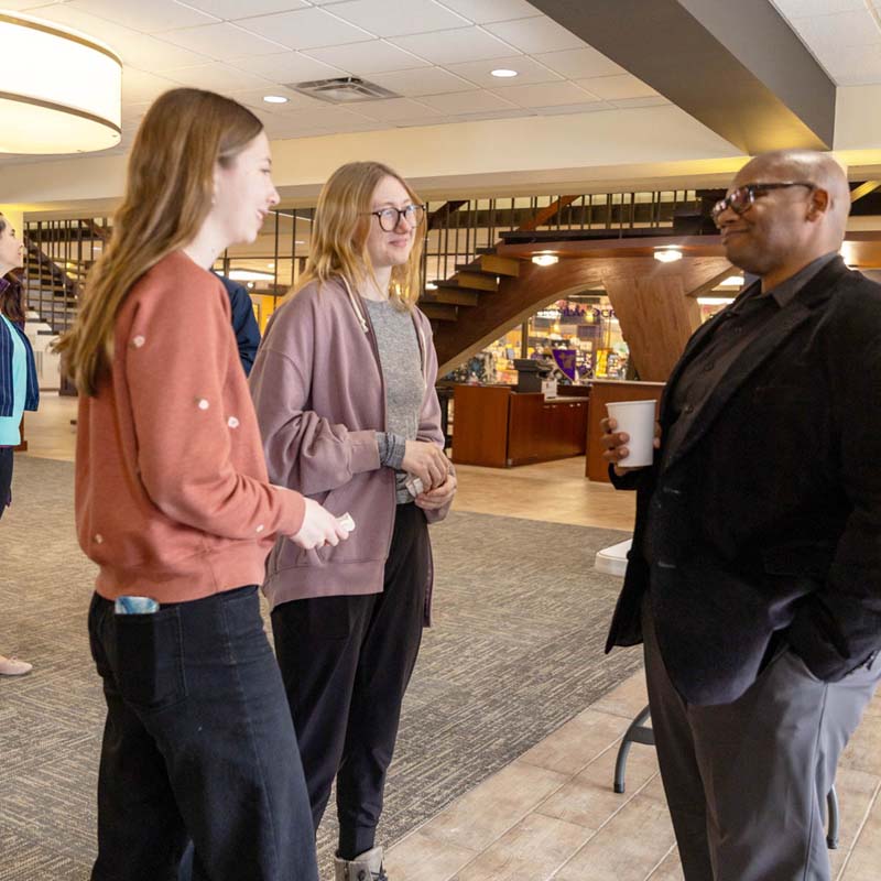 President Lewis talking to students