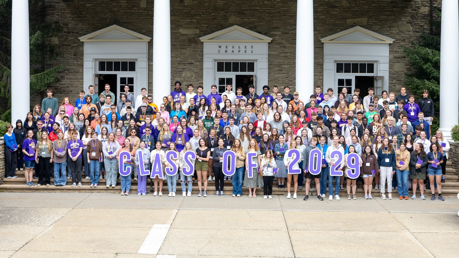 Class of 2029 standing on the houghton chapel steps