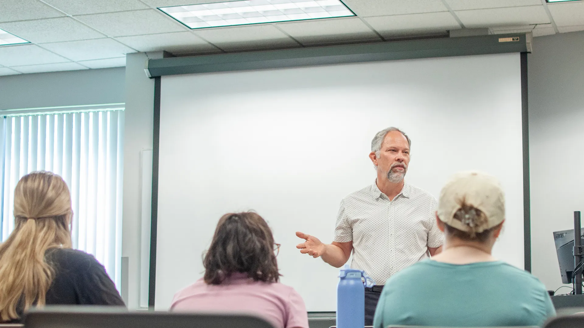 Houghton Professor Jonathan Gates teaching in a classroom