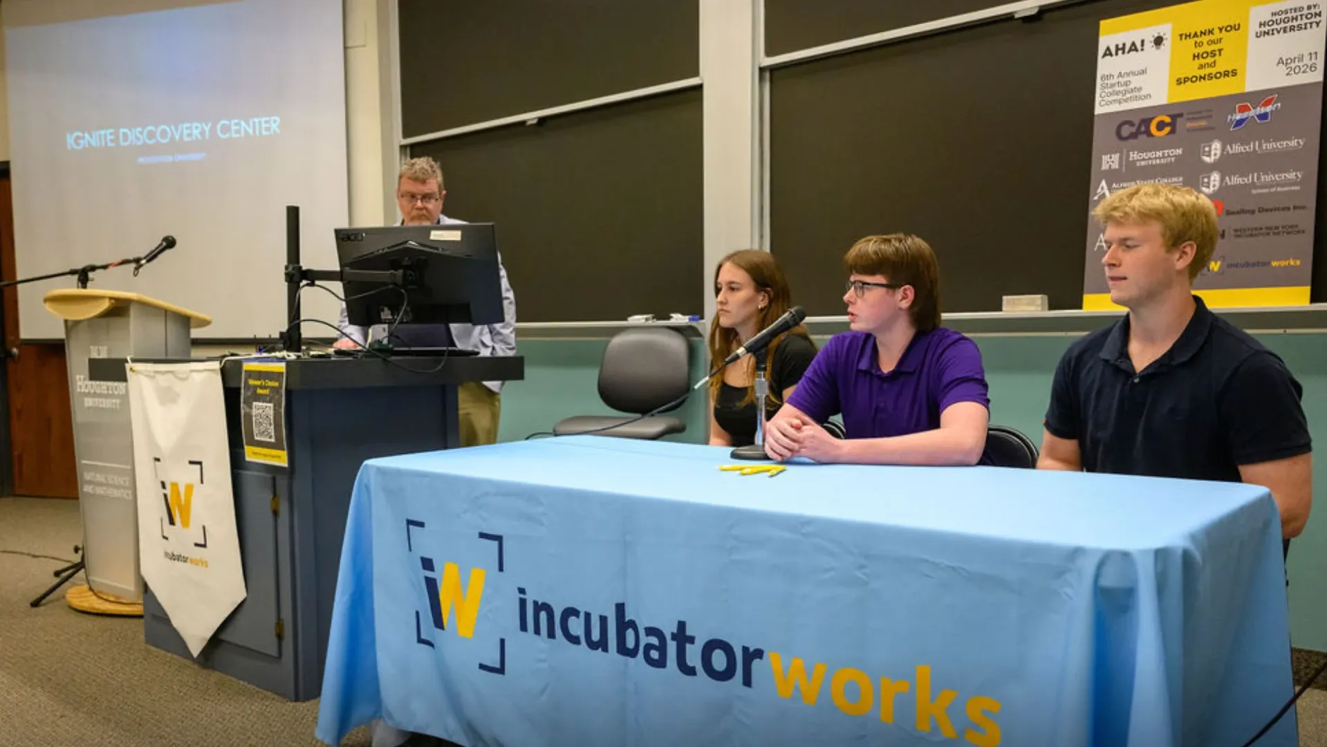 AHA conference and students at the table