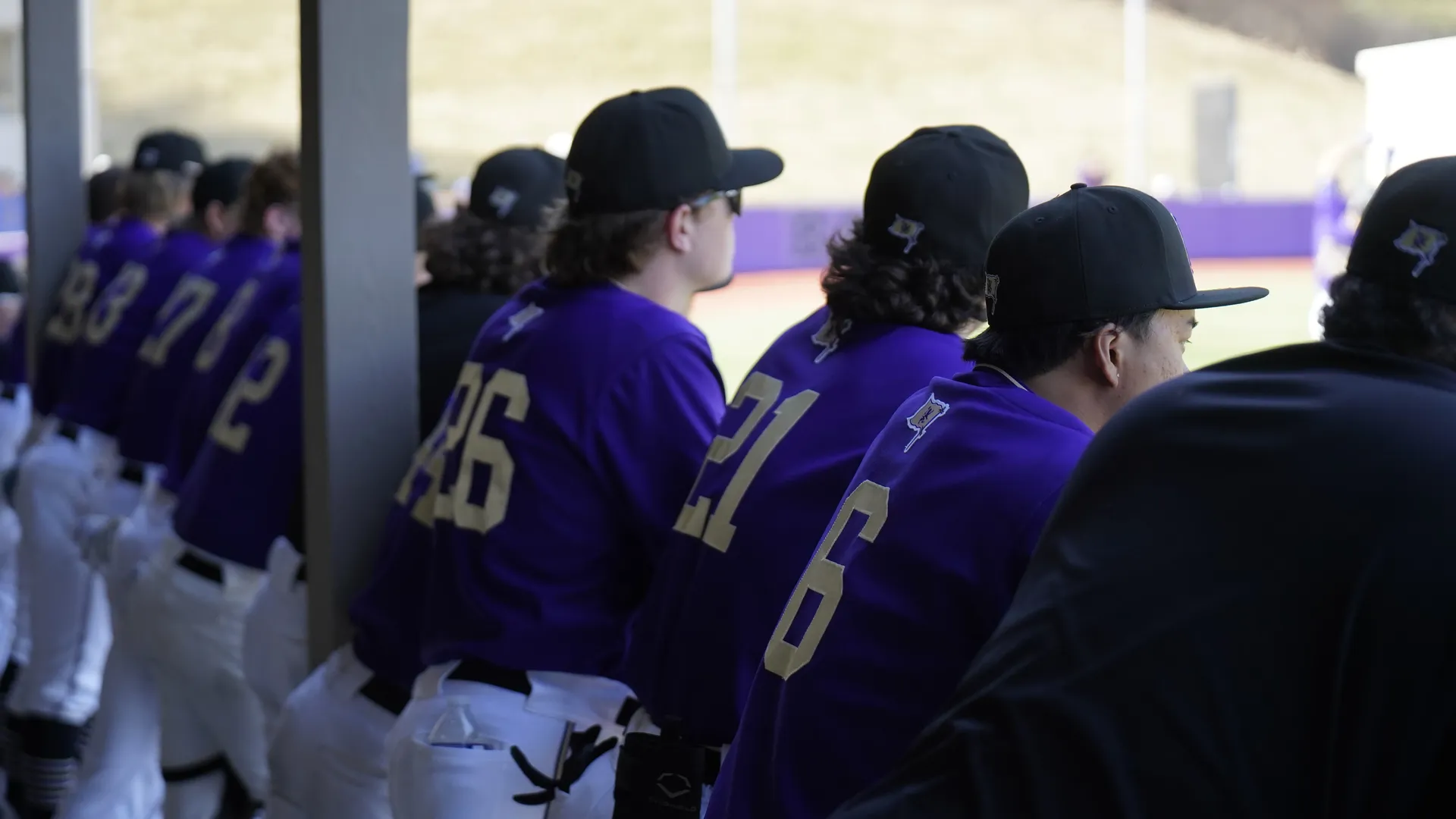 Line up of baseball players in the dugout