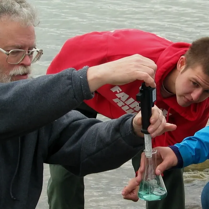 Professor and student doing field work