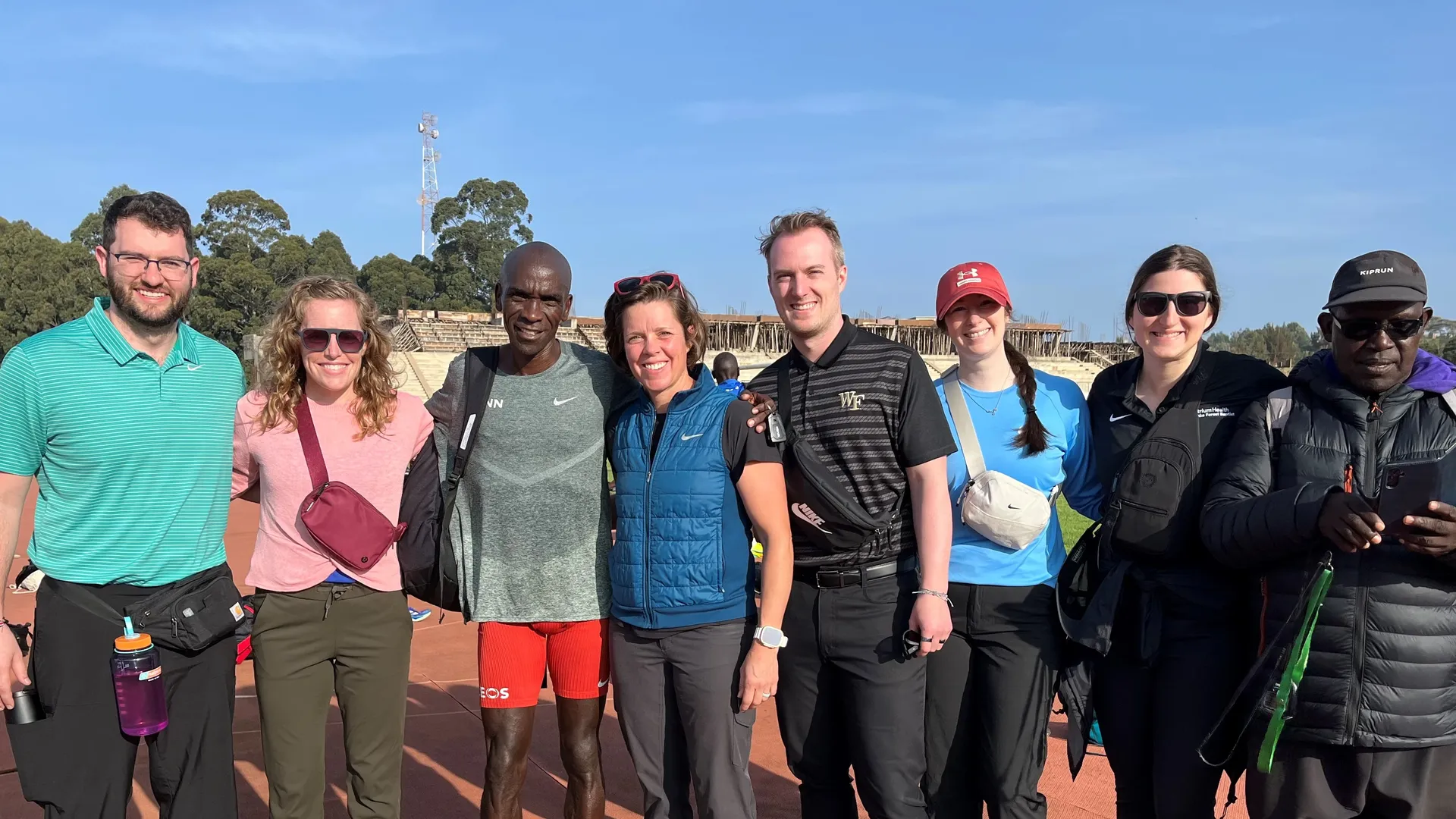 Group photo with Laura Lintner for magazine, standing outside